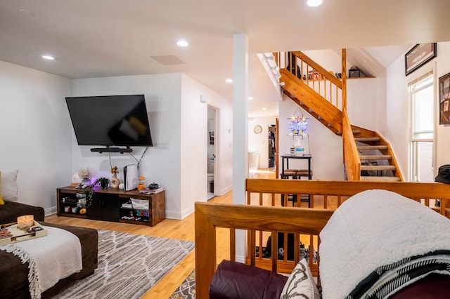 2512 N Marshfield Ave, Chicago, IL 60614 - living area featuring wood finished floors, stairway, baseboards, and recessed lighting