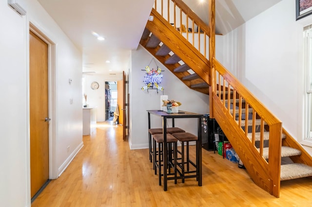2512 N Marshfield Ave, Chicago, IL 60614 - stairs featuring wood finished floors, recessed lighting, and baseboards