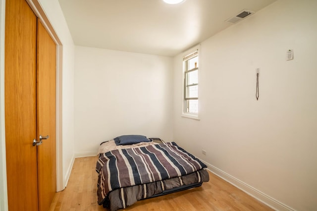 2512 N Marshfield Ave, Chicago, IL 60614 - bedroom featuring baseboards and light wood-style floors