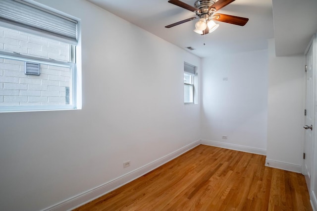 2512 N Marshfield Ave, Chicago, IL 60614 - empty room with a ceiling fan, light wood-type flooring, and baseboards