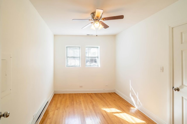 2512 N Marshfield Ave, Chicago, IL 60614 - spare room featuring ceiling fan, light wood-style flooring, baseboards, and baseboard heating