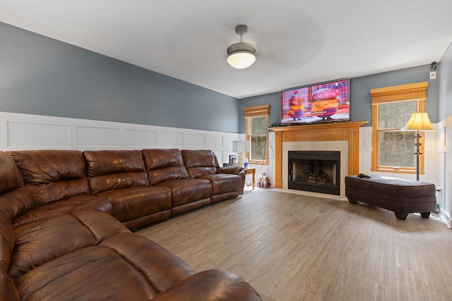 3739 Applewood Ln, Rockford, IL 61114 - living area with a decorative wall, wood finished floors, a fireplace, and wainscoting