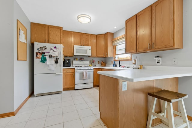 3739 Applewood Ln, Rockford, IL 61114 - kitchen featuring white appliances, a sink, a peninsula, light countertops, and brown cabinets