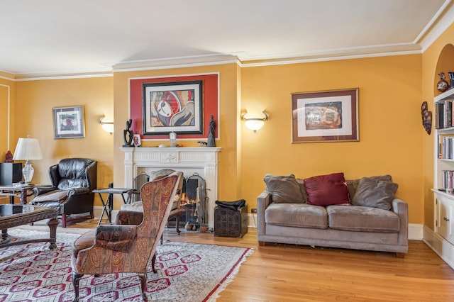 5000 S E End Ave Unit 13A, Chicago, IL 60615 - living room featuring light wood finished floors, ornamental molding, a warm lit fireplace, and baseboards