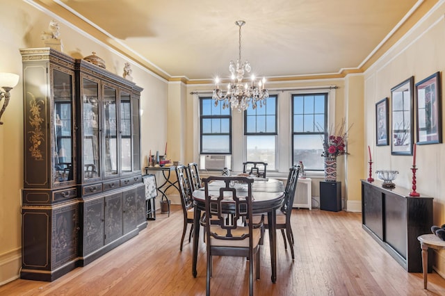 5000 S E End Ave Unit 13A, Chicago, IL 60615 - dining room featuring a chandelier, light wood-style floors, crown molding, cooling unit, and baseboards
