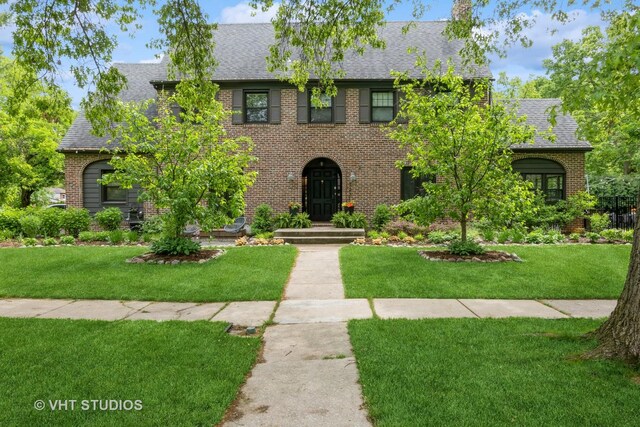 723 Gardner Rd, Flossmoor, IL 60422 - view of front facade with brick siding, a shingled roof, and a front lawn