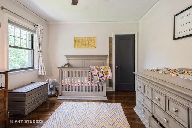 723 Gardner Rd, Flossmoor, IL 60422 - bedroom with dark wood finished floors, crown molding, a nursery area, and a ceiling fan