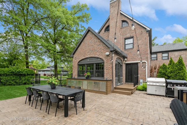 723 Gardner Rd, Flossmoor, IL 60422 - rear view of property featuring brick siding, a patio area, a chimney, and outdoor dining area