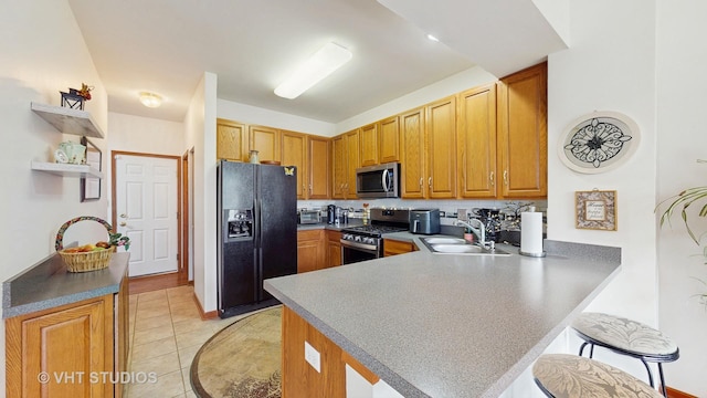 105 Grandview Ct, Volo, IL 60020 - kitchen with appliances with stainless steel finishes, a sink, a peninsula, open shelves, and a breakfast bar