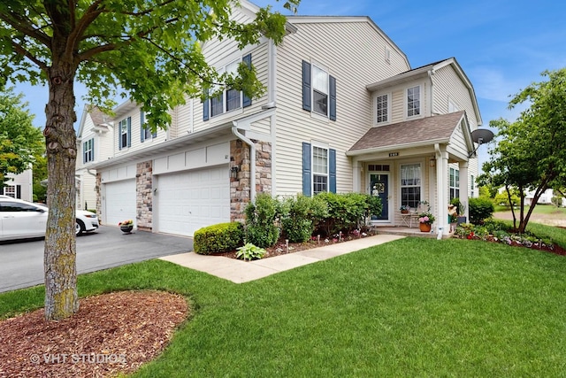 105 Grandview Ct, Volo, IL 60020 - view of front of home with an attached garage, driveway, a front lawn, and stone siding