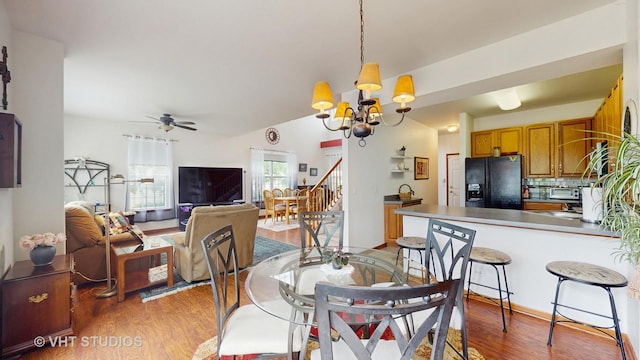 105 Grandview Ct, Volo, IL 60020 - dining room with a chandelier, ceiling fan, light wood-type flooring, and stairway