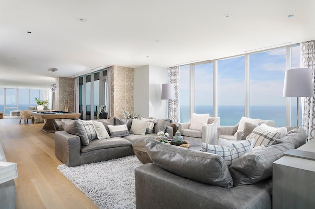 363 E Wacker Dr Unit 6106, Chicago, IL 60601 - living room with pool table, light wood-style floors, a wall of windows, and a water view