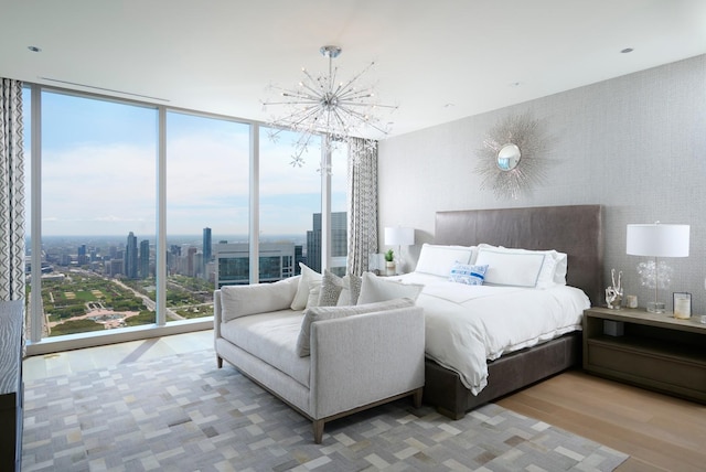 363 E Wacker Dr Unit 6106, Chicago, IL 60601 - bedroom with floor to ceiling windows, wood finished floors, a chandelier, and a view of city