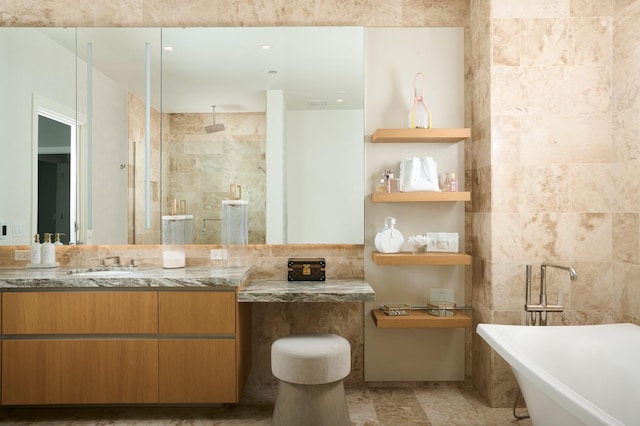 363 E Wacker Dr Unit 6106, Chicago, IL 60601 - full bathroom with a freestanding tub, vanity, tiled shower, and tile walls