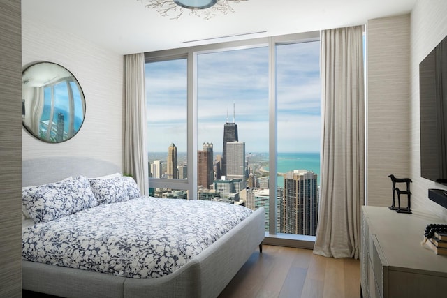 363 E Wacker Dr Unit 6106, Chicago, IL 60601 - bedroom with expansive windows, wood finished floors, and multiple windows