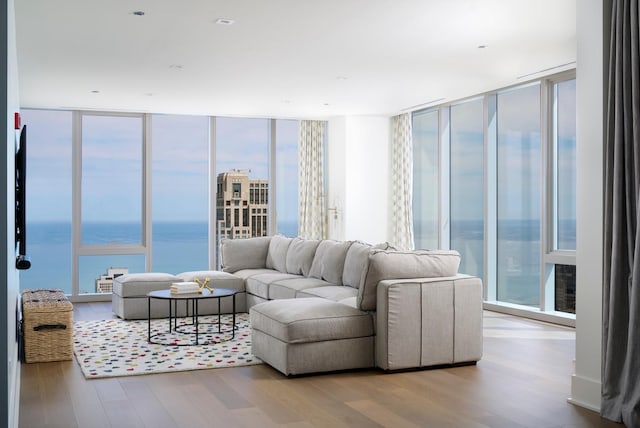 363 E Wacker Dr Unit 6106, Chicago, IL 60601 - living area featuring a wall of windows, wood finished floors, and a water view