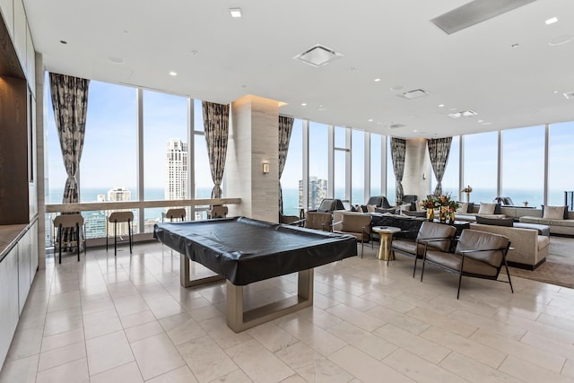 363 E Wacker Dr Unit 6106, Chicago, IL 60601 - recreation room featuring floor to ceiling windows, billiards table, a water view, light tile patterned floors, and a city view