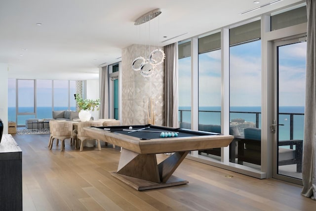 363 E Wacker Dr Unit 6106, Chicago, IL 60601 - recreation room featuring a wall of windows, a water view, wood finished floors, and billiards