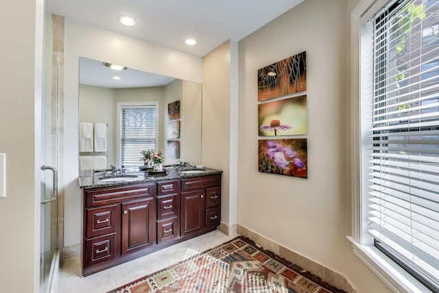 5484 S Hyde Park Blvd, Chicago, IL 60615 - bathroom featuring baseboards, healthy amount of natural light, double vanity, tile patterned flooring, and recessed lighting