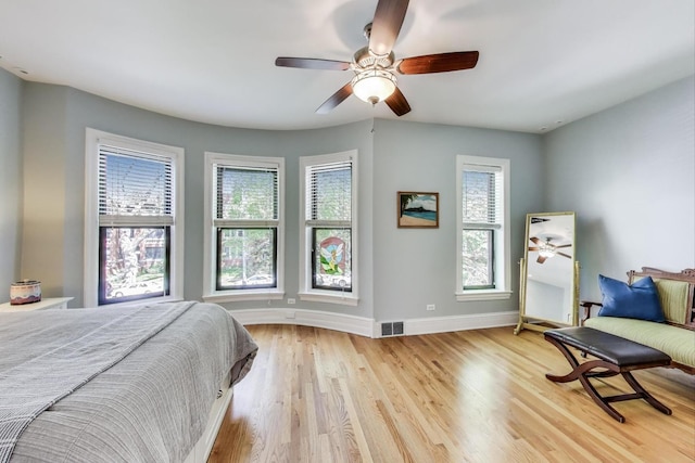 5484 S Hyde Park Blvd, Chicago, IL 60615 - bedroom featuring baseboards, light wood-style floors, and a ceiling fan