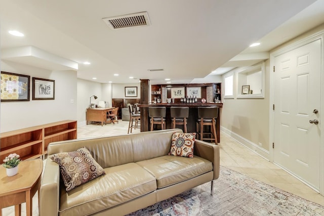 5484 S Hyde Park Blvd, Chicago, IL 60615 - tiled living room featuring baseboards, recessed lighting, and bar