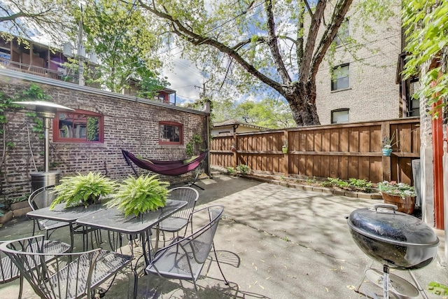 5484 S Hyde Park Blvd, Chicago, IL 60615 - fenced backyard featuring a patio and outdoor dining space