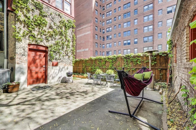 5484 S Hyde Park Blvd, Chicago, IL 60615 - view of patio / terrace with outdoor dining space and cooling unit