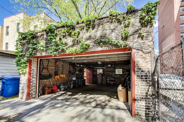 5484 S Hyde Park Blvd, Chicago, IL 60615 - view of front facade with a garage, driveway, and brick siding