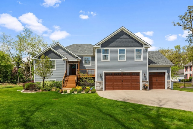 589 Quassey Ave, Lake Bluff, IL 60044 - view of front facade featuring driveway, a front lawn, stone siding, roof with shingles, and a deck