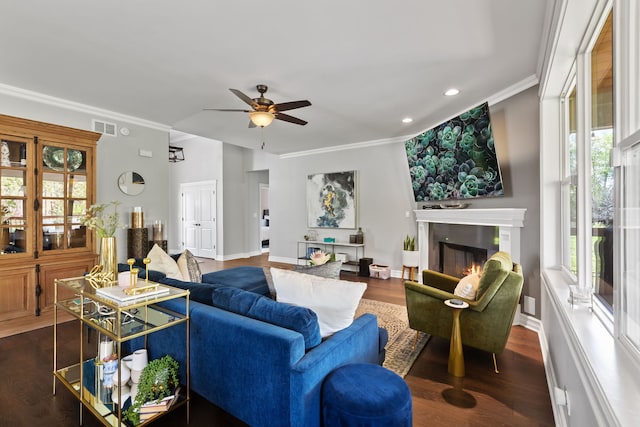 589 Quassey Ave, Lake Bluff, IL 60044 - living room featuring plenty of natural light, a ceiling fan, recessed lighting, ornamental molding, and a glass covered fireplace