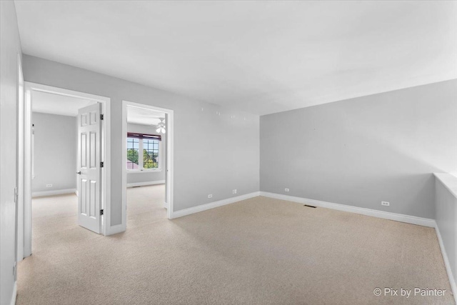 18104 Lake Shore Dr, Orland Park, IL 60467 - spare room featuring baseboards, carpet floors, and ceiling fan