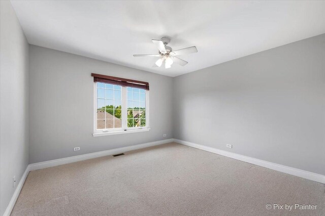 18104 Lake Shore Dr, Orland Park, IL 60467 - unfurnished room with ceiling fan, baseboards, and carpet floors