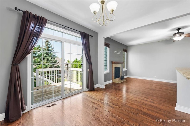 18104 Lake Shore Dr, Orland Park, IL 60467 - unfurnished living room with a chandelier, wood finished floors, baseboards, a fireplace with flush hearth, and ceiling fan