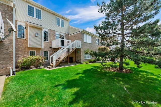 18104 Lake Shore Dr, Orland Park, IL 60467 - rear view of house featuring stairway, a yard, a wooden deck, and brick siding