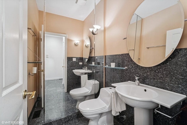 3305 Old Glenview Rd Unit A, Wilmette, IL 60091 - half bathroom with toilet, granite floors, and tile walls