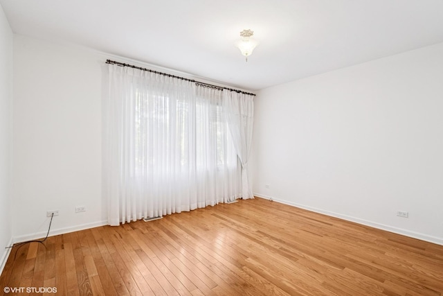 3305 Old Glenview Rd Unit A, Wilmette, IL 60091 - unfurnished room with light wood finished floors and baseboards