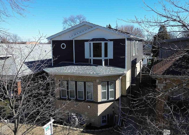 view of front of house featuring brick siding