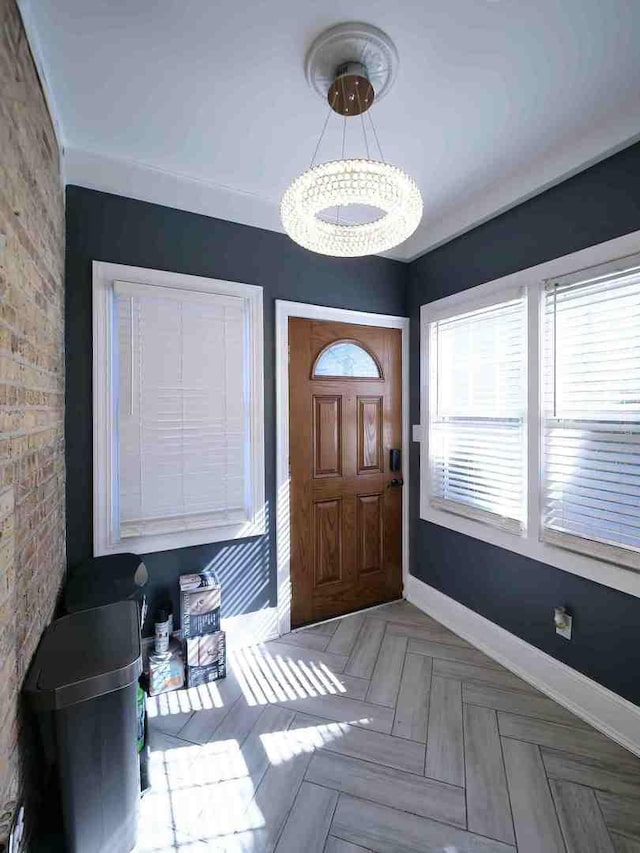 foyer featuring baseboards