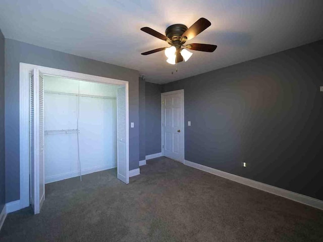 unfurnished bedroom with carpet floors, a closet, baseboards, and ceiling fan