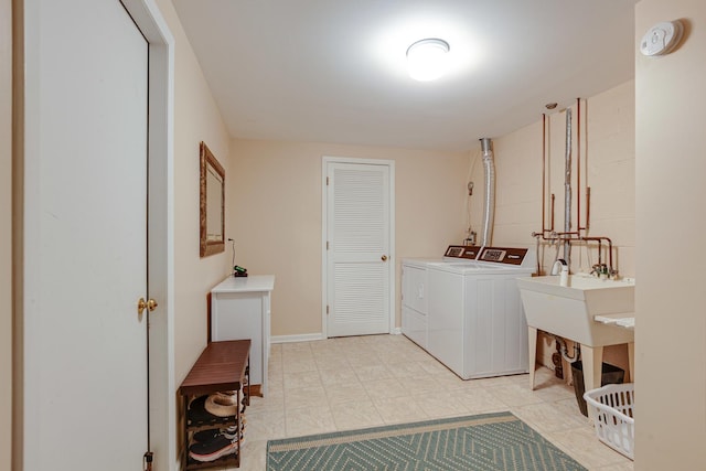 1111 S Waukegan Rd Unit 10, Lake Forest, IL 60045 - laundry area featuring washing machine and clothes dryer and light tile patterned flooring