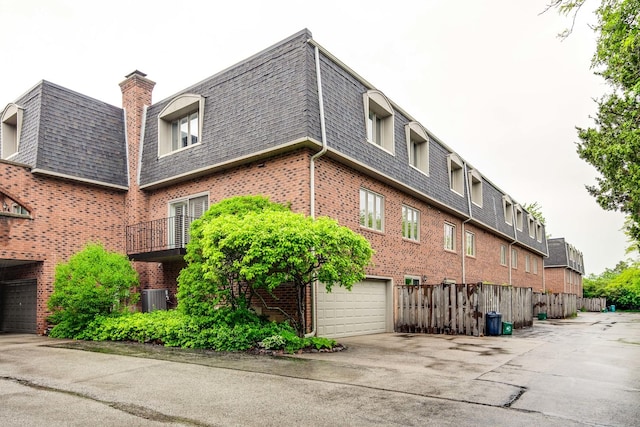 1111 S Waukegan Rd Unit 10, Lake Forest, IL 60045 - view of building exterior with a garage and driveway