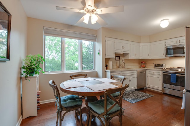1111 S Waukegan Rd Unit 10, Lake Forest, IL 60045 - dining area with dark wood finished floors, ceiling fan, and baseboards