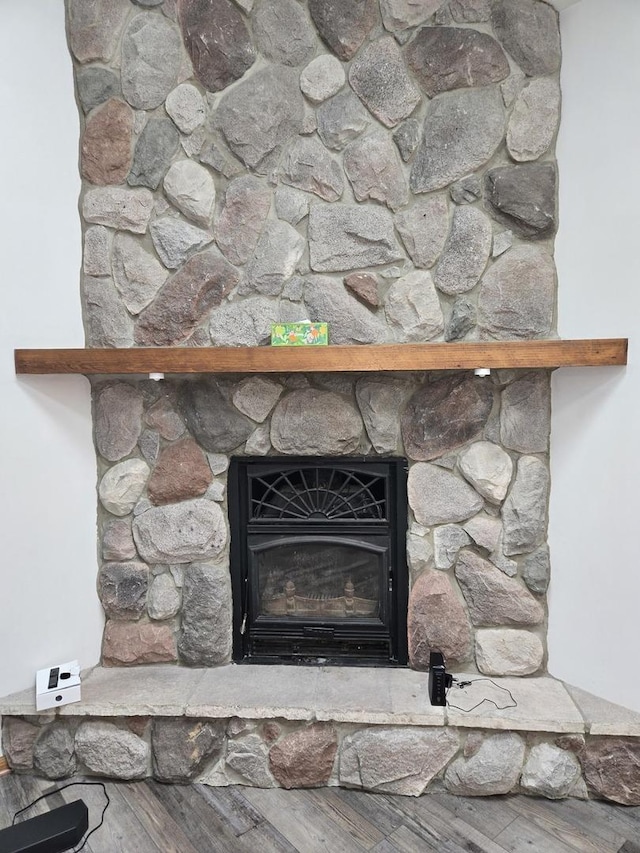 1988 S Chana Rd, Chana, IL 61015 - detailed view of a large fireplace and wood finished floors