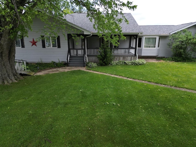 1988 S Chana Rd, Chana, IL 61015 - ranch-style home with a shingled roof, a front yard, and covered porch