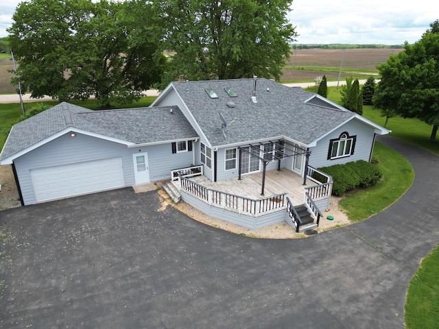 1988 S Chana Rd, Chana, IL 61015 - view of front of home with asphalt driveway, a shingled roof, and a garage