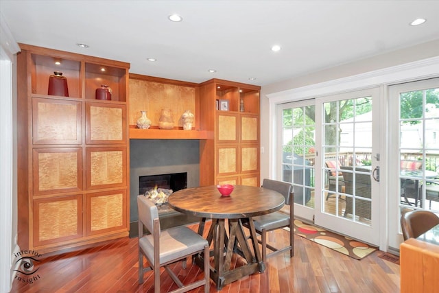 616 E Hillside Ave, Barrington, IL 60010 - dining area with wood-type flooring, a lit fireplace, and recessed lighting