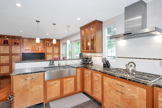 616 E Hillside Ave, Barrington, IL 60010 - kitchen featuring range hood, stainless steel gas stovetop, a peninsula, dark stone countertops, and plenty of natural light