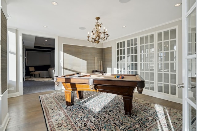 playroom featuring billiards table, wood finished floors, a chandelier, ornamental molding, and baseboards