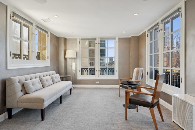 sitting room featuring baseboards, carpet, and recessed lighting