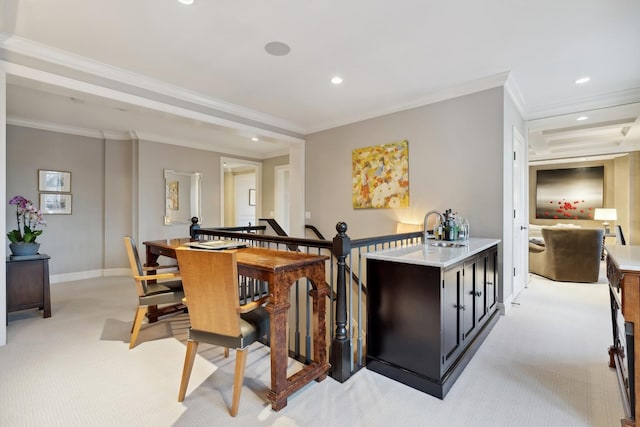 bar featuring light carpet, a sink, baseboards, recessed lighting, and crown molding
